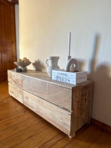 a wooden dresser with books on top of it at B&B La Vista Brava in Platja  d'Aro