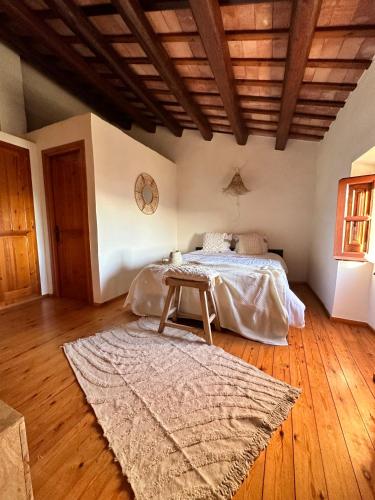 a bedroom with a bed and a wooden ceiling at B&B La Vista Brava in Platja  d'Aro