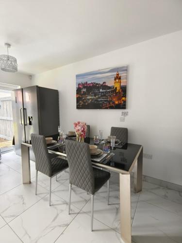 a dining room with a table and chairs at Shared House - 10 mins from Piccadilly Station/Man Uni/O2 Apollo in Manchester