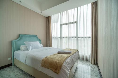 Giường trong phòng chung tại Luxury & Bright 2BR Chianti Tower Mall Access
