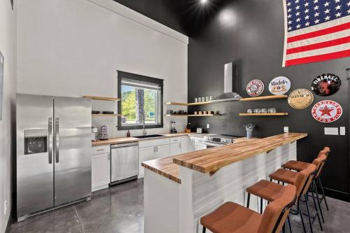 a kitchen with an american flag on the wall at New Barndo/Kayak Launch/ 2 Private Hot Tubs in Stanton