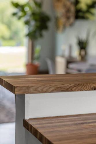 a close up of a wooden counter top on a table at New Barndo/Kayak Launch/ 2 Private Hot Tubs in Stanton