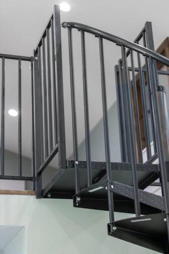 a set of stairs with a metal railing at New Barndo/Kayak Launch/ 2 Private Hot Tubs in Stanton