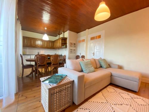 a living room with a couch and a table at Casa dos Frades in Vinhais