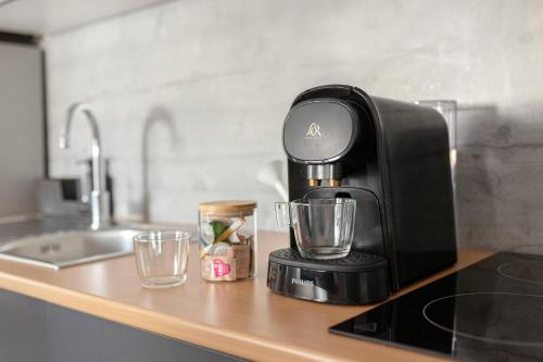 a coffee maker sitting on top of a kitchen counter at Deluxe Apartments 55 in Kranjska Gora