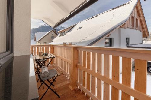 a balcony with a table and a view of the mountains at Deluxe Apartments 55 in Kranjska Gora