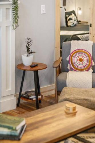 a living room with a table and a couch at ATV Trailer Parking/NEW/5 min to Natural Bridge in Campton