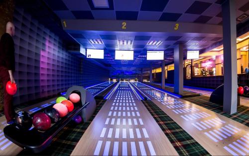 a bowling alley with balls on the lanes at Złote Arkady in Częstochowa