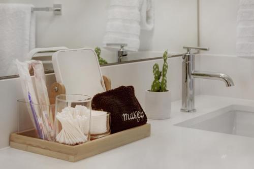 a bathroom counter with a wooden tray with towels at Gorgeous NEW Townhome on Capitol Hill, Close to Everything! in Seattle