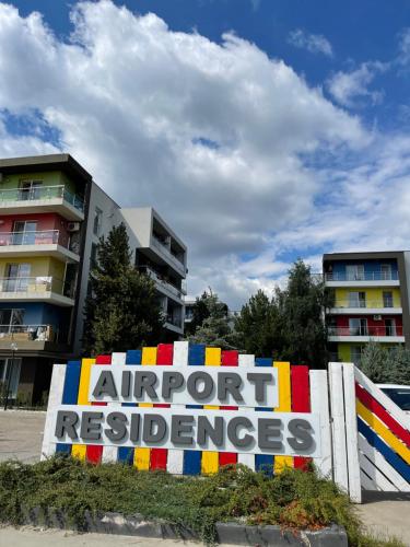a sign in front of a building that reads support refugees at Mathias Airport Residences & Therme-Self Check-in in Otopeni