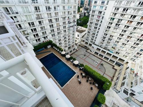 an overhead view of a pool in the middle of buildings at EzyStay Boutique Suites in Lucknow