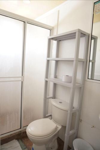 a bathroom with a white toilet in a room at Posada J&J Forbes - 1 in San Andrés