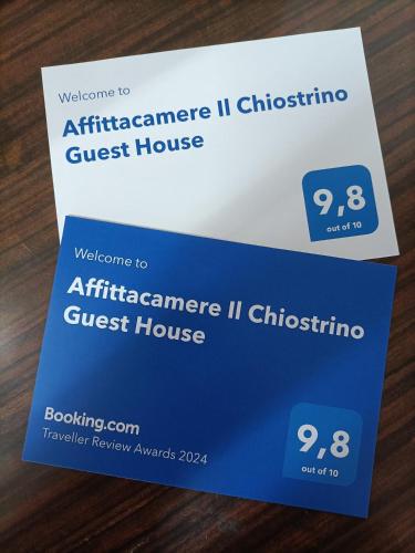 a blue and white guest house card on a table at Affittacamere Il Chiostrino Guest House in Florence