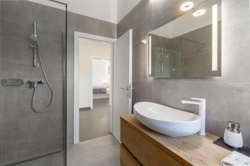 a bathroom with a sink and a shower at Villa Opal in Tar