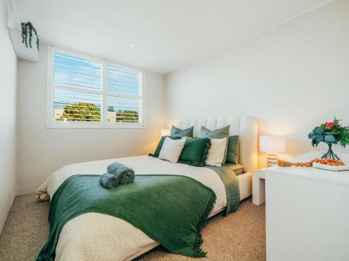 a bedroom with a large bed and a window at XQ Collection Saltwater Bondi Beach in Sydney