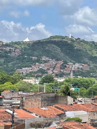 a view of a mountain with houses and roofs at Hotel Shalom in Juazeiro do Norte