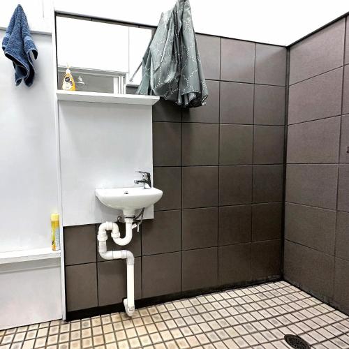 a bathroom with a sink and a mirror at Unit 1 Golden Sands Retreat in Wagait Beach