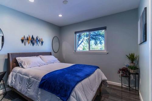 a bedroom with a bed and a window at Discover the Ultimate Trending Hot Tub Retreat in El Paso