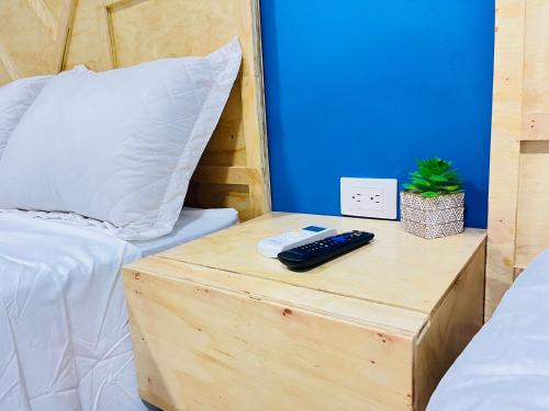 Ein Bett oder Betten in einem Zimmer der Unterkunft WE Hotel, La Lima