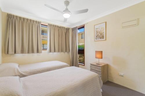 a bedroom with two beds and a window at Unit 2 8 Banks Avenue in Tweed Heads