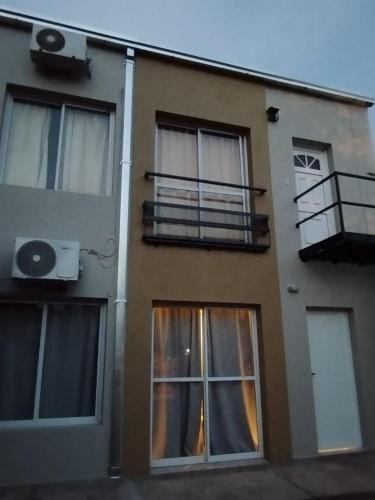 a building with windows and a balcony on it at Andrade in Colón