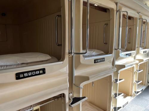 an interior view of an rv with its doors open at 男性専用サウナ&カプセル Men Only Capsule Room & Sauna, Bathhouse ミナミ下北沢 Minami Shimokitazawa in Tokyo