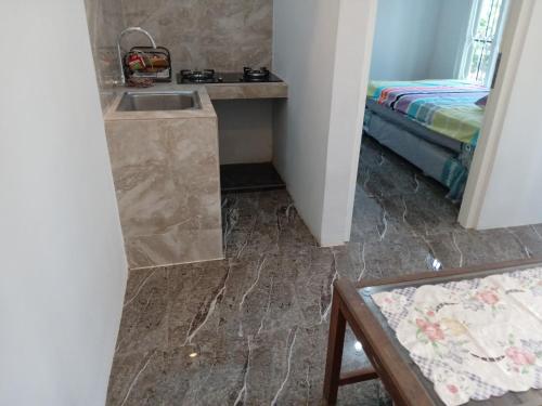 Ένα ή περισσότερα κρεβάτια σε δωμάτιο στο Siroen Homestay