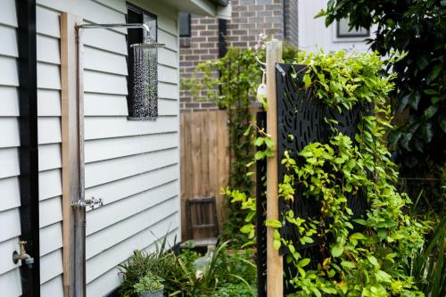 a door to a house with a fence at Jujube in Dromana
