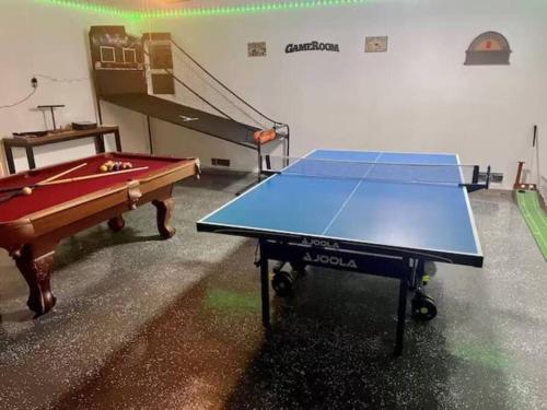 a ping pong table in a room with a ping pong ball at Family Home by Disney+Knotts, Pool,Game Room in Fullerton