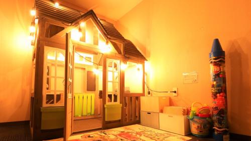 a room with a toy house on the wall at A-GATE Hotel Hakodate in Hakodate