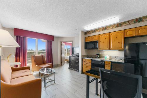 a kitchen and living room with a couch and a table at Metro Scottsdale Promo 1 bd 1 in Scottsdale