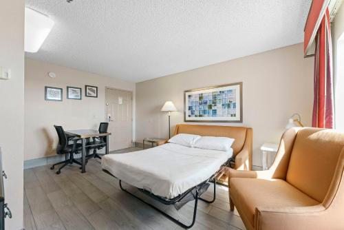 a hospital room with a bed and a chair at Metro Scottsdale Promo 1 bd 1 in Scottsdale