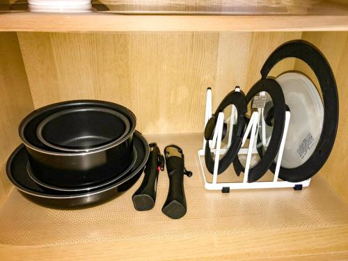a shelf with pans and utensils in a kitchen at Niruyakanaya BISE - Vacation STAY 36704v in Bise