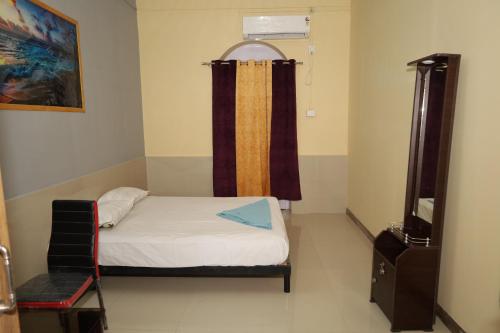 A bed or beds in a room at RAIL NEST