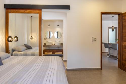 Ліжко або ліжка в номері CALA Suites & Lofts