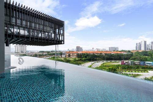 a swimming pool on the roof of a building at 2-Bedroom Condominium in LUMI TROPICANA in Petaling Jaya