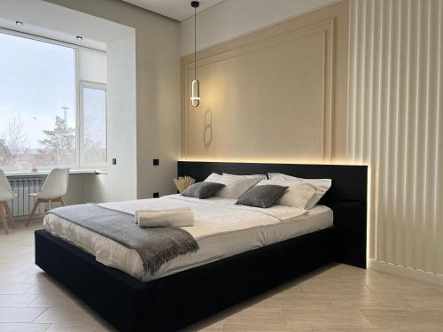 Postel nebo postele na pokoji v ubytování Апартаменты LUX (Smart 8)