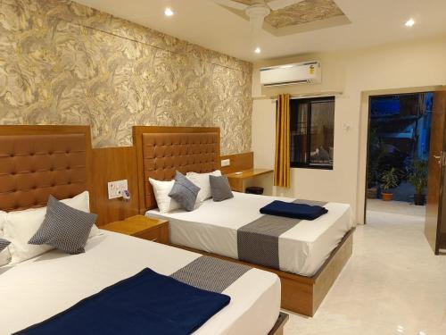Postel nebo postele na pokoji v ubytování Hotel BKC Fortune