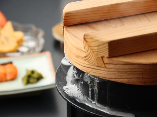 a cake on a table with a plate of food at Bandai in Tokamachi