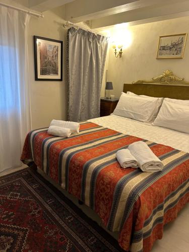 Voodi või voodid majutusasutuse Familly rooms (two rooms) Cà del Traghetto toas