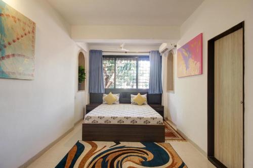 Rahul Service Apartmentにあるベッド