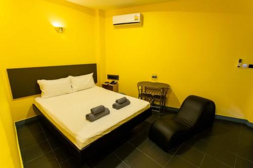 Postel nebo postele na pokoji v ubytování S3 Hotel (Rayong)