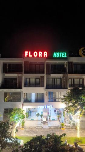 a hotel with a sign that reads flor hotel at night at FLORA Hotel Phu Quoc in Phu Quoc
