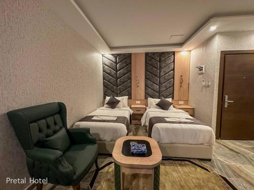 Ένα ή περισσότερα κρεβάτια σε δωμάτιο στο Pretal Hotel