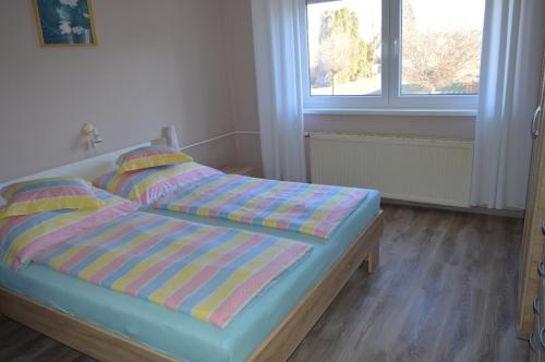 Posteľ alebo postele v izbe v ubytovaní Karolina Appartman