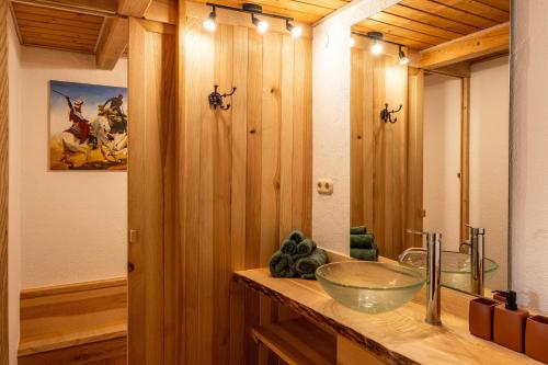 a bathroom with a sink and a bowl on a counter at Bauernhaus Untermoos in Breitenbach am Inn