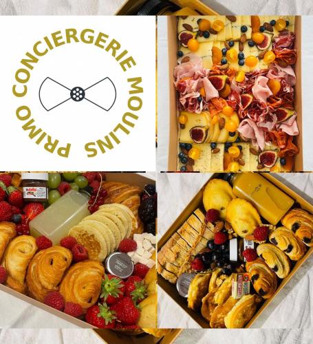 une boîte remplie de différents types de fruits et de pâtisseries dans l'établissement Joli studio Le Rosa Bonheur, proche de la gare, à Yzeure