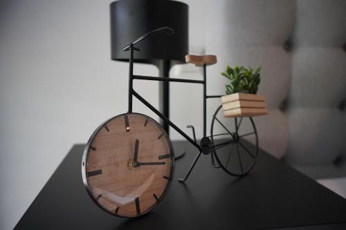 a bicycle with a clock on a table at PureNature Appartement in Obersontheim