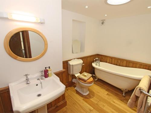 a bathroom with a tub and a toilet and a sink at 3 Bed in Northumberland National Park CN043 in Alwinton