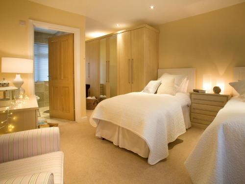 a large bedroom with two beds and a bathroom at 2 Bed in Cartmel LCC47 in Cartmel